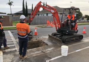 Commercial plumbing experts doing work at a Geelong road.