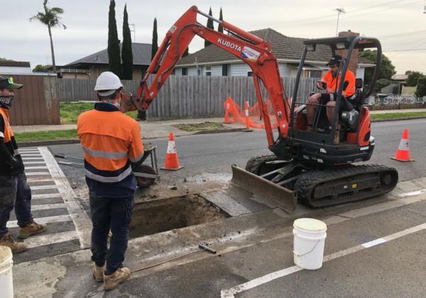 Commercial plumbing experts doing work at a Geelong road.
